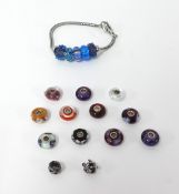 A Troll bead bracelet with 5 blue beads and an additional 13 loose beads, silver mounted with a