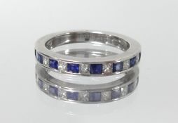 A 18ct white gold sapphire and diamond half band eternity ring, marked 'KK 750', size J.