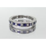 A 18ct white gold sapphire and diamond half band eternity ring, marked 'KK 750', size J.