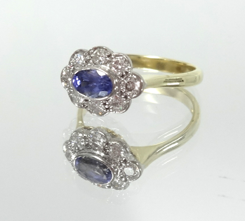 An 18ct tanzanite and diamond cluster ring, size N. - Image 2 of 2