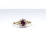 An 18ct ruby and diamond cluster ring, size O.