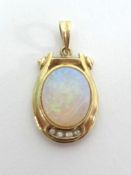 A 14ct opal and diamond set pendant.