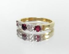 An 18ct ruby and diamond five stone ring, size L.