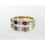 An 18ct ruby and diamond five stone ring, size L.