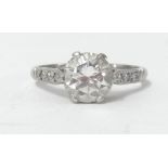 A platinum and diamond set ring, the centre stone approx 1.50ct, size N.