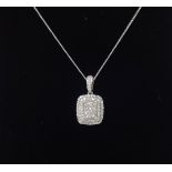 An 18ct white gold diamond pendant and chain.