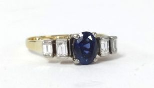 A sapphire and diamond five stone ring set with baguette cut diamonds, size M.