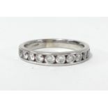 A 9ct diamond and half band eternity ring with ten round brilliant cut diamonds, weight approx 0.