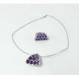 An impressive 18ct white gold amethyst and diamond pendant together with a matching ring, size N.