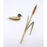 A modern 18ct gold and enamel duck brooch and a 18ct water reed brooch, approx 12.30gms (2).