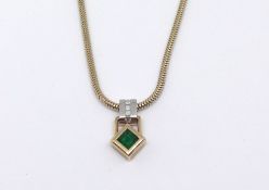 An emerald and diamond pendant necklace.