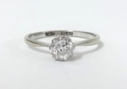 An 18ct white gold and platinum diamond solitaire ring, size N.