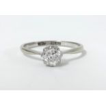 An 18ct white gold and platinum diamond solitaire ring, size N.