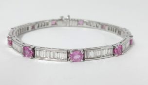 An 18ct white gold diamond and pink sapphire bracelet, length 20cm.