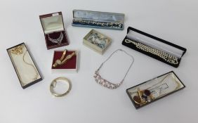 Various costume jewellery, the contents of a walnut jewellery box.