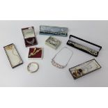 Various costume jewellery, the contents of a walnut jewellery box.