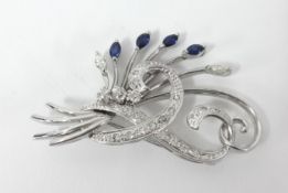 A fine 18ct white gold diamond and sapphire brooch marked '750, H.S', width 43mm, height 24mm.