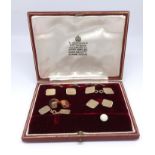 Garrard & Co, a 9ct gold gents shirt set in original case, approx 12gms.