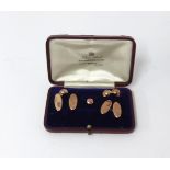 A gents 9ct gold dress shirt set comprising a pair of cufflinks (AF) and four studs, approx 6.