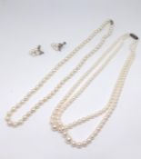 Two Mikimoto pearl necklaces each with silver clasp marked 'M' together with a pair of Mikimoto