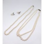 Two Mikimoto pearl necklaces each with silver clasp marked 'M' together with a pair of Mikimoto