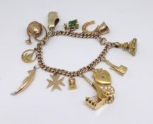 A mixed 9ct and 14ct gold charm bracelet, approx 49.30gms.