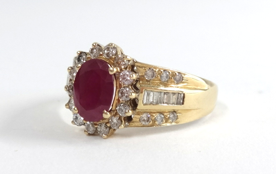 A 14ct ruby and diamond cluster ring, size T.