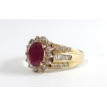 A 14ct ruby and diamond cluster ring, size T.