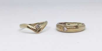 Two 9ct gold dress rings each set with a small diamond, 3.6gms.