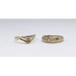 Two 9ct gold dress rings each set with a small diamond, 3.6gms.