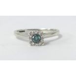 A 9ct white gold blue diamond cluster ring, size L.