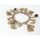 A 9ct gold charm bracelet, approx 12 charms, total weight 56.50gms.