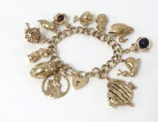 A 9ct gold charm bracelet, approx 12 charms, total weight 56.50gms.