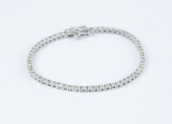 An 18ct white gold diamond tennis bracelet set with approx 3cts of diamonds.