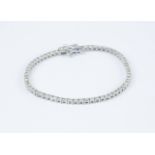 An 18ct white gold diamond tennis bracelet set with approx 3cts of diamonds.