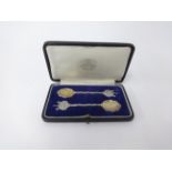 Salters Company, a pair of silver and gilt presentation spoons with certificate, cased.