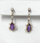 A pair of teardrop amethyst and seed pearl earrings mounted in yellow gold.