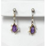 A pair of teardrop amethyst and seed pearl earrings mounted in yellow gold.