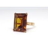 A 18k single stone citrine ring, size M.