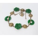 A jade and yellow gold bracelet.