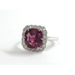 An 18ct diamond and tourmaline ring, size Q.