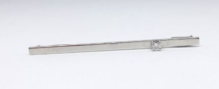 A white metal bar brooch set with diamond marked '585', 2.60gms.