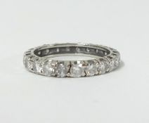 A diamond full band eternity ring set in white gold, size L.