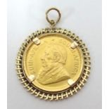 A gold 1980 1/10oz krugerrand coin mounted, approx 4.30gms.