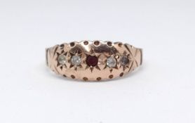 An antique 9ct rose gold ruby and diamond ring, size O.