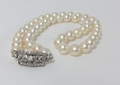 A string of cultured pearls with an 18ct diamond clasp.