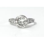 An 18ct white gold diamond ring the centre stone approx 2.80ct, further set with three round cut
