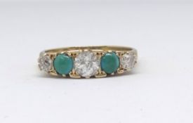 An 18ct turquoise and diamond five stone ring, size P.