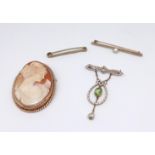 A 9ct cameo brooch, a 15ct pearl bar brooch, a 9ct bar brooch and an antique peridot and enamelled
