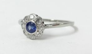 An 18ct white gold diamond and sapphire cluster ring, size O.